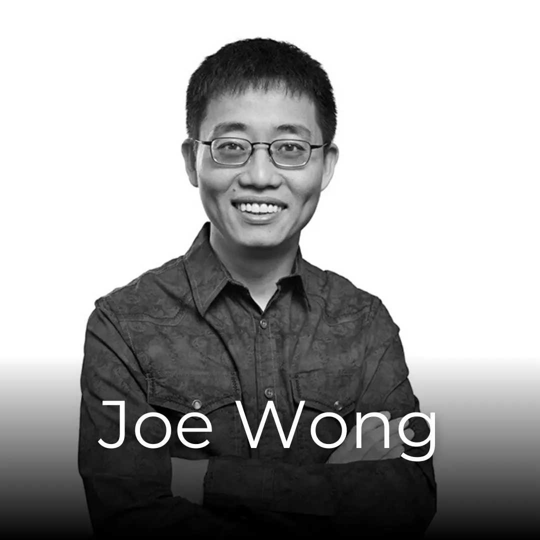 Picture of the comedian Joe Wong smiling whilst looking at the camera.